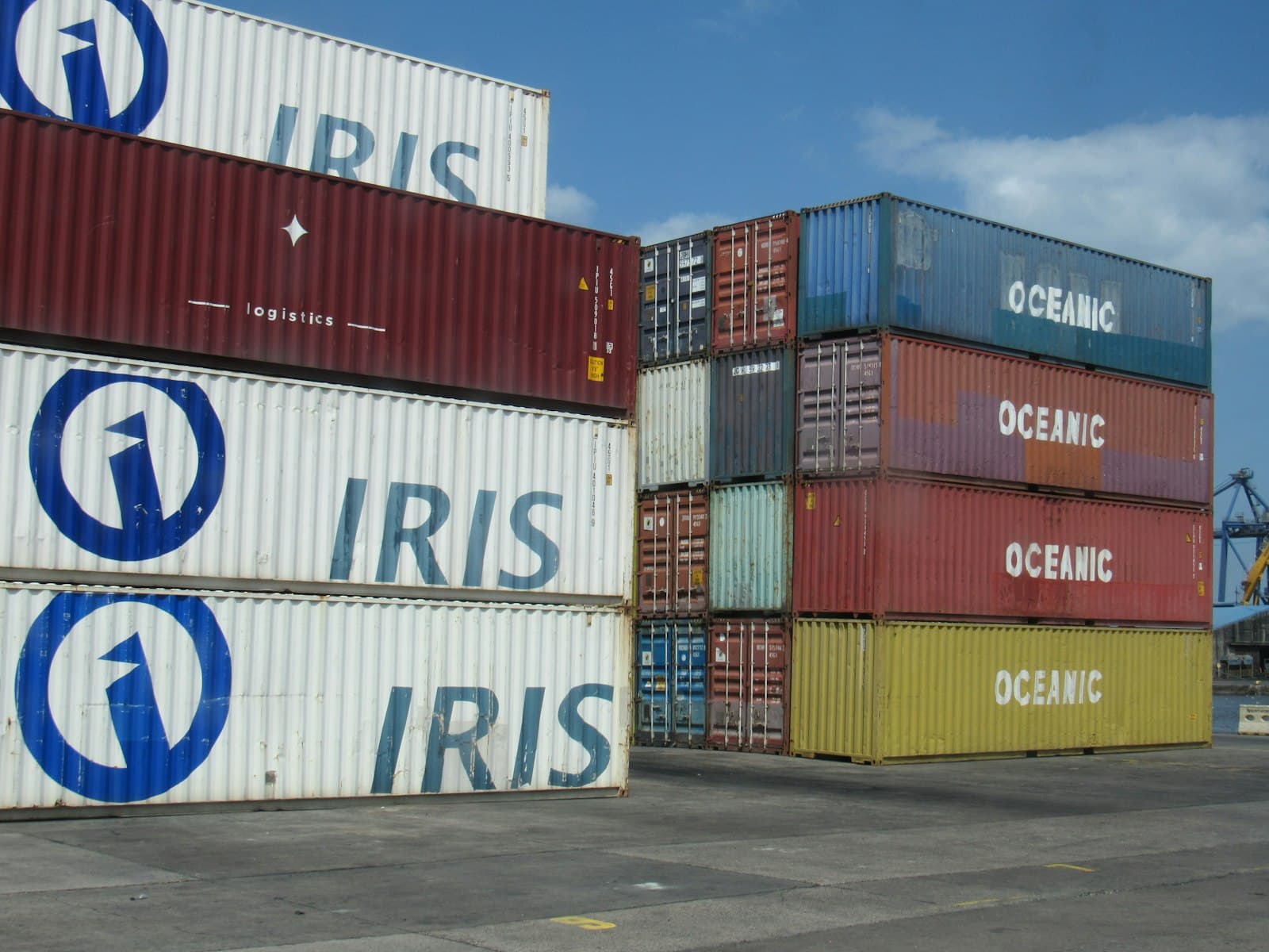 Shipping containers stacked at an outdoor storage yard